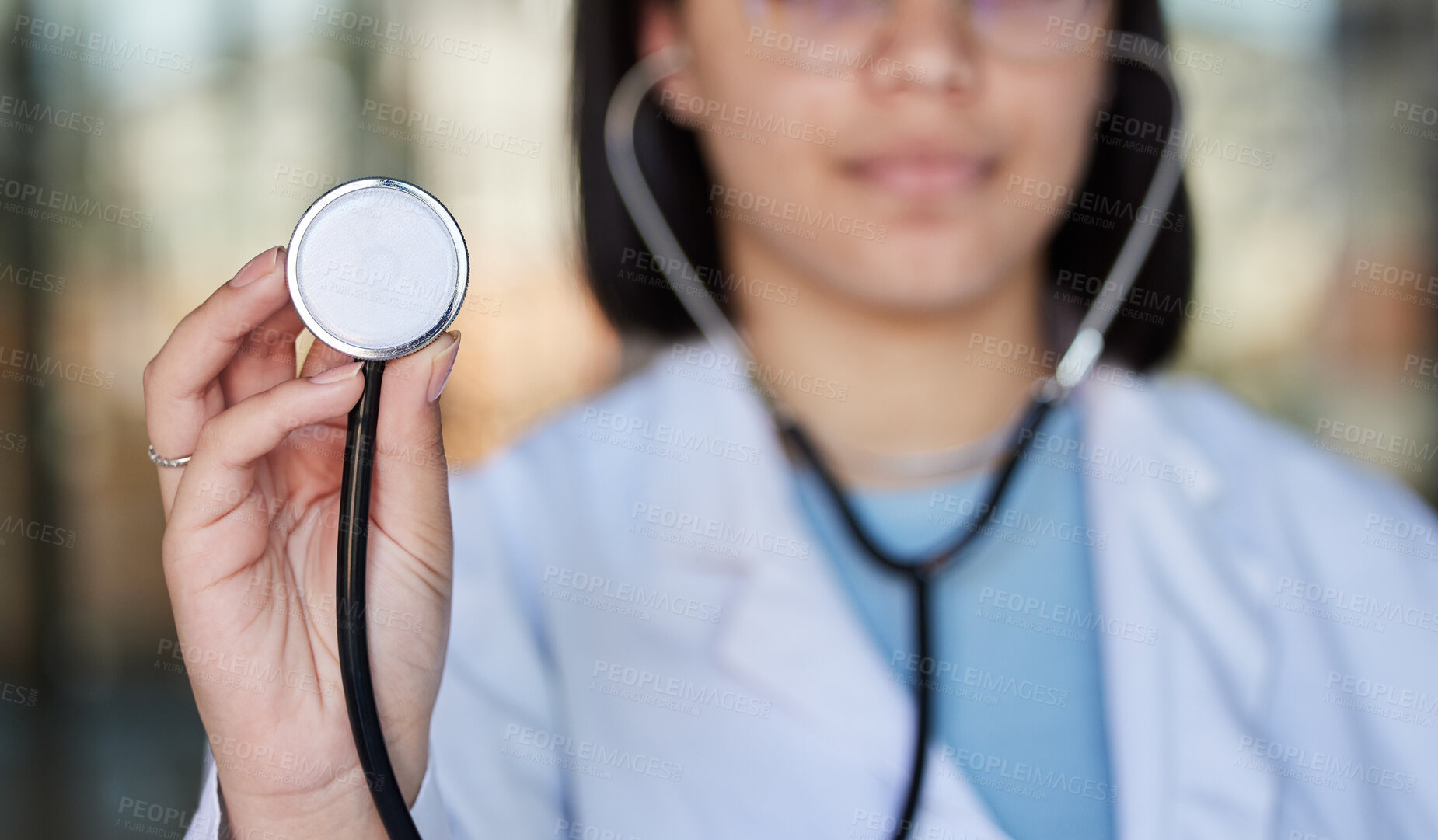 Buy stock photo Healthcare, stethoscope and hands of doctor listen in clinic for wellness, medical care and check up. Hospital, cardiology mockup and woman worker with tools for heart disease, exam and consulting