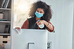 Covid, compliance and a black woman cleaning her computer in the office for health, safety or control. Business, bacteria and regulations with a female employee wiping her desktop pc for disinfection