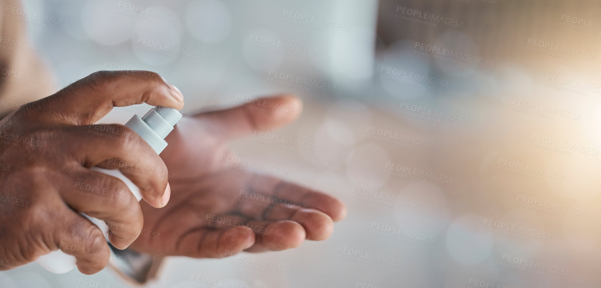 Buy stock photo Hands, spray sanitizer and bacteria safety with mockup space, blurred background and healthcare. Palm, bottle and disinfection from virus, cleaning and self care to stop covid with medical mock up