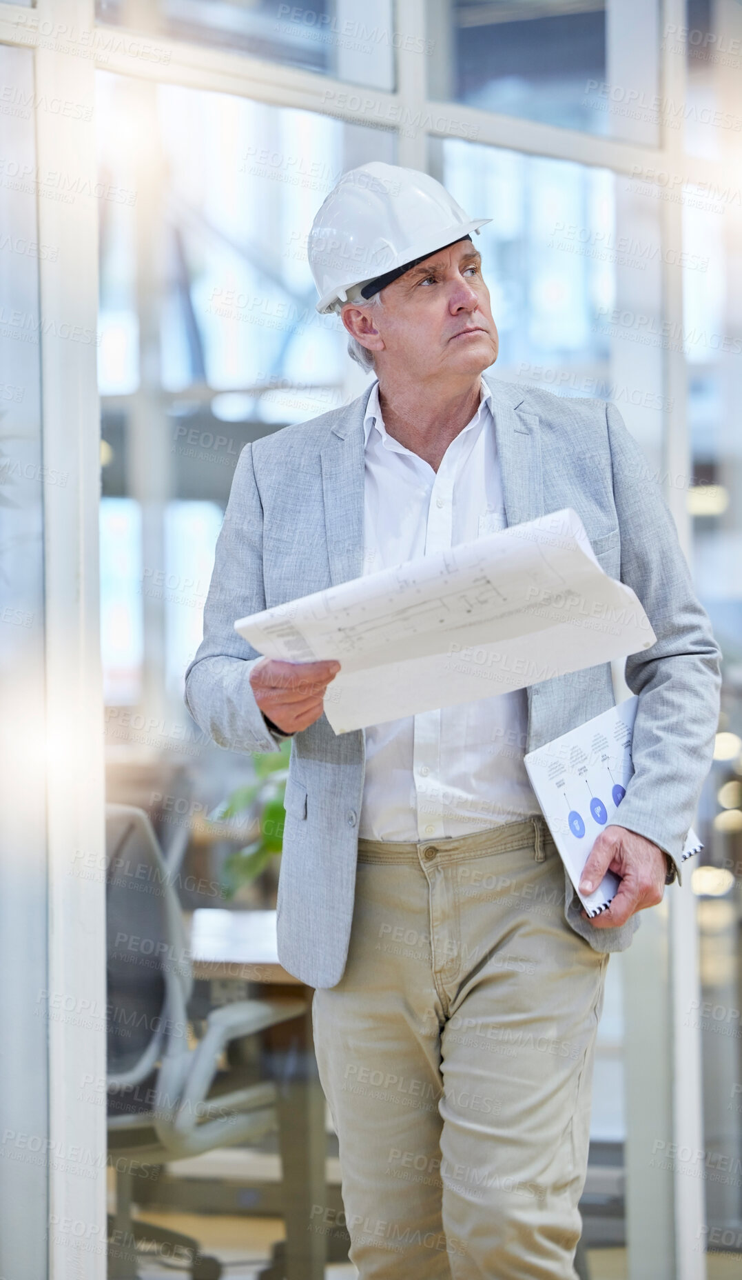 Buy stock photo Mature man, blueprint and construction manager walking in building site, project management and design. Engineering, contractor and thinking of floor plan for architecture, development and innovation