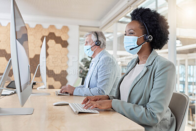 Buy stock photo Covid, masks and call center agents in compliance working as a team on customer service in an office typing. Computer, Consultant and telemarketing colleagues in a company doing technical support