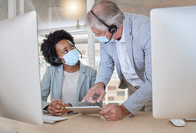 Buy stock photo Covid, black woman and man with tablet at call center with mask coaching and helping at help desk. Compliance, consulting and opinion, crm data for medical advisory agency with diversity and support.