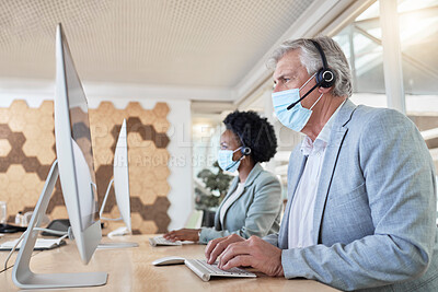 Buy stock photo Covid, call center employees with mask at computer and senior man with black woman in headset. Office compliance, consulting team online in shared workspace and medical advisory agency with diversity