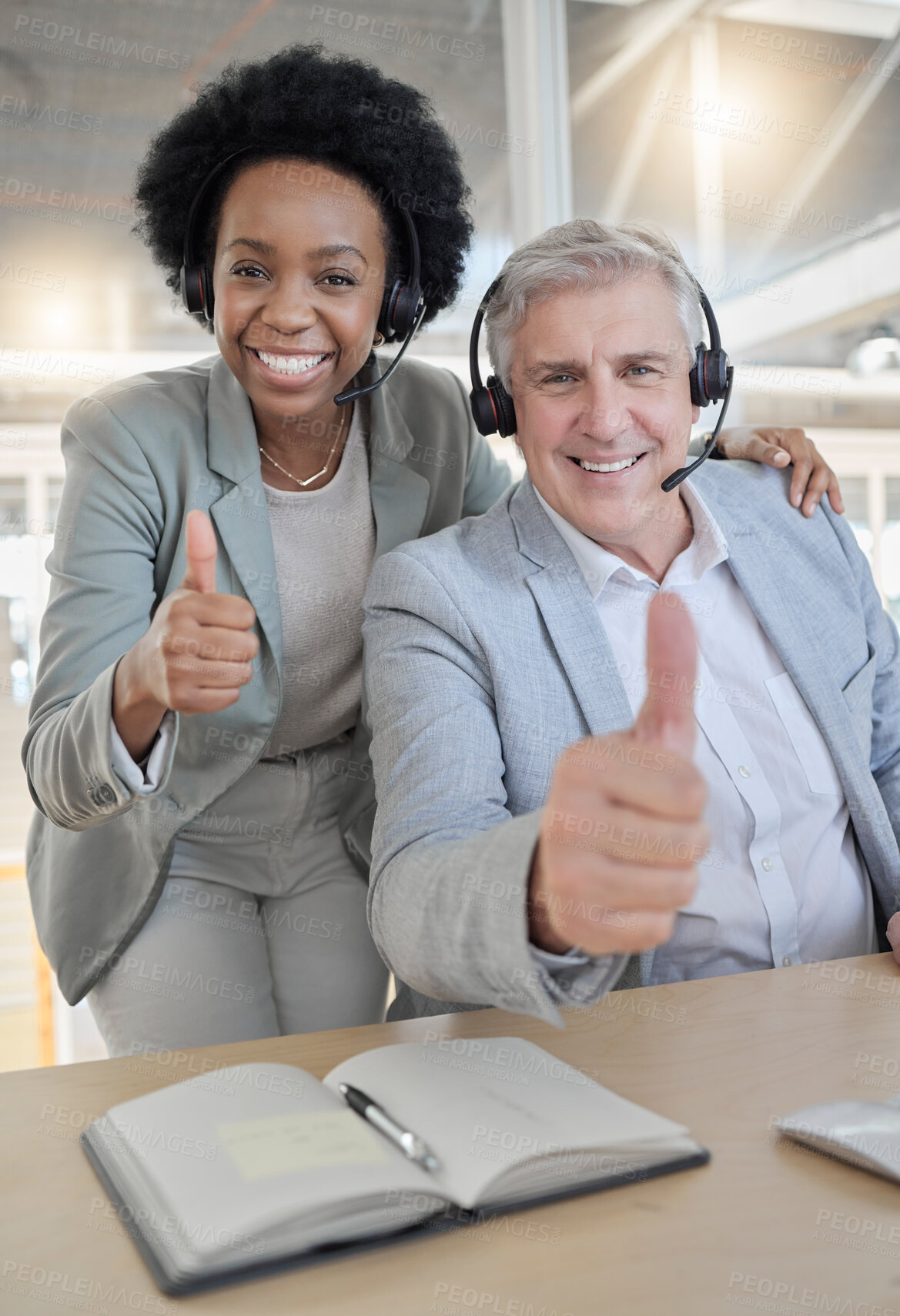 Buy stock photo Customer support, thumbs up and portrait of black woman and man happy at desk in office. Contact us, help desk and teamwork with smile and notebook at advisory agency for crm training at call center.