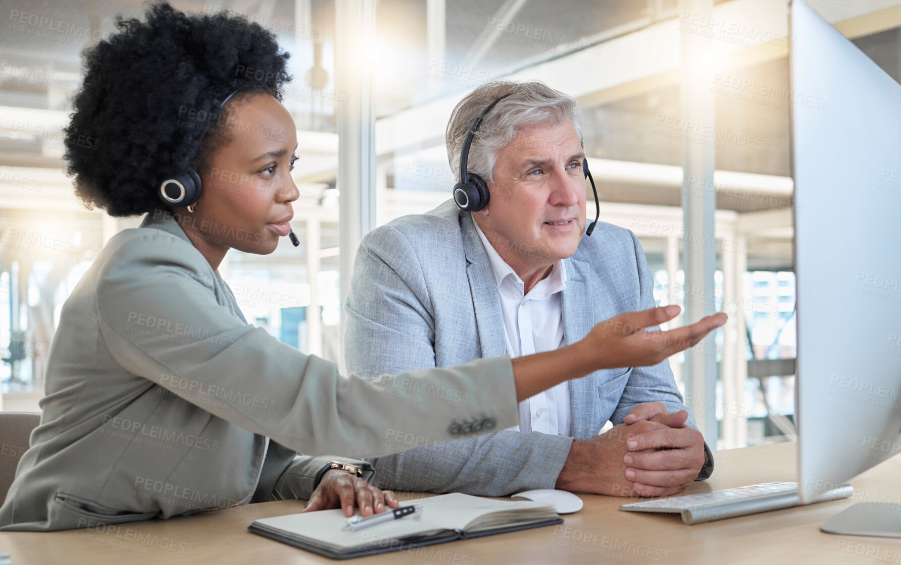 Buy stock photo Call center, teamwork and coaching, black woman with man at computer at help desk office. Customer service consultant manager, support and training at advisory agency with diversity and trust in team