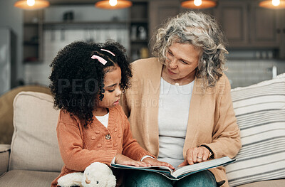 Buy stock photo Family kid, book and grandmother reading fantasy storybook, story or bonding on home living room sofa. Love, grandma babysitting and senior woman with child development for adoption kindergarten girl