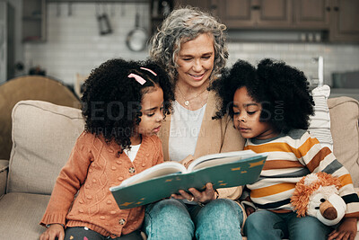 Buy stock photo Family children, book and grandma reading fantasy storybook, story or bond on home living room sofa. Love, grandma babysitting and elderly woman with child development for biracial kindergarten kids