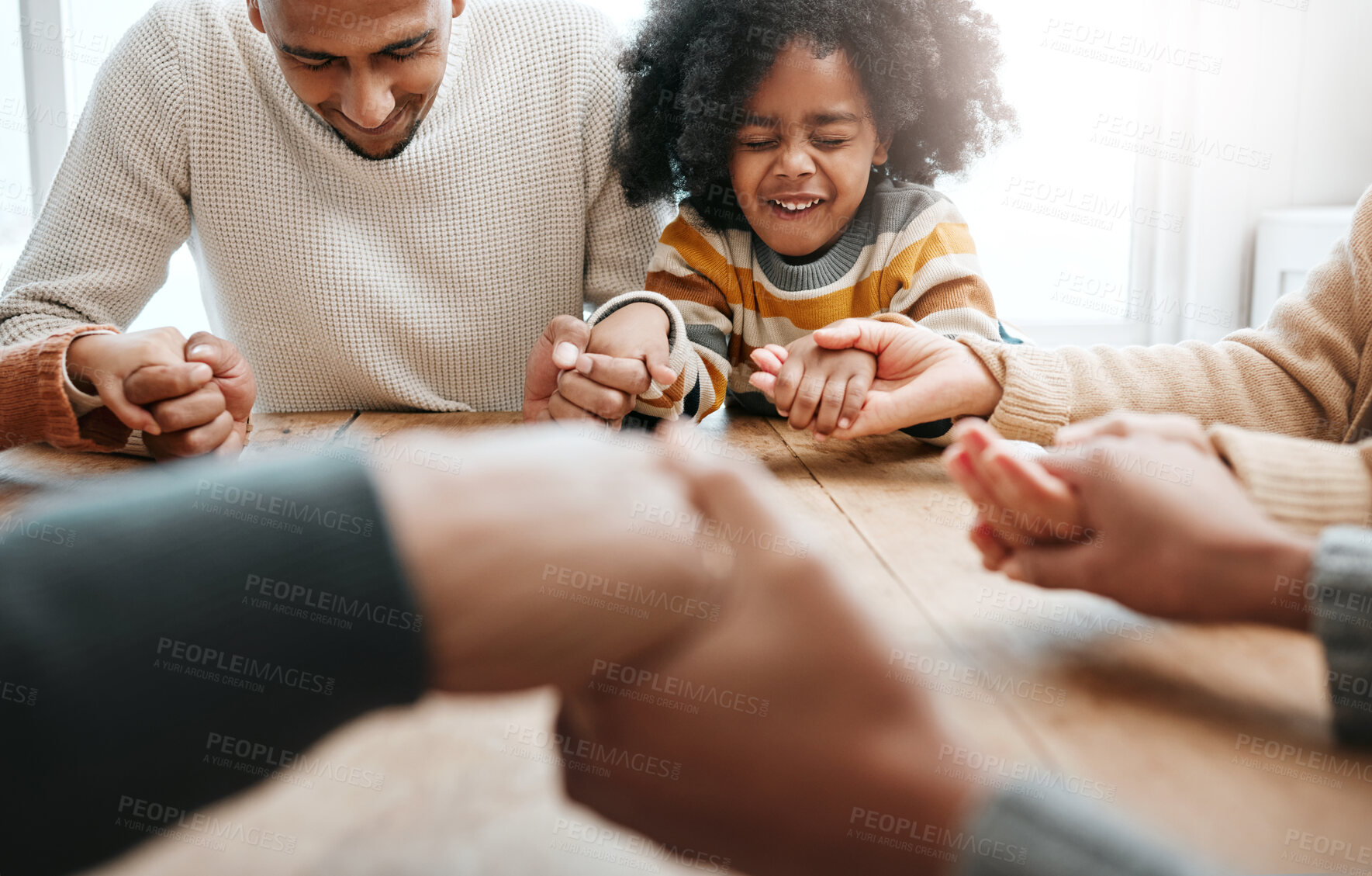 Buy stock photo Praying, together and family holding hands for worship, support and church service. Happy, hope and a father, child and people with prayer, faith and belief in religion, grateful and praising