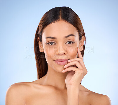 Buy stock photo Beauty, skincare and portrait of woman in studio for satisfaction, confidence and self care. Glow, facial and spa with face of woman isolated on blue background for makeup, dermatology and pride
