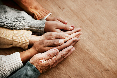Buy stock photo People, hands together and generations in care above on mockup for unity, compassion or trust on wooden table. Group holding hand in collaboration, love or support for community, teamwork or union