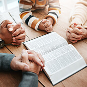 Bible, reading book or hands of big family praying for support or hope in  Christian home for worship together. Mother, father or grandparents  studying, prayer or asking God in religion with children