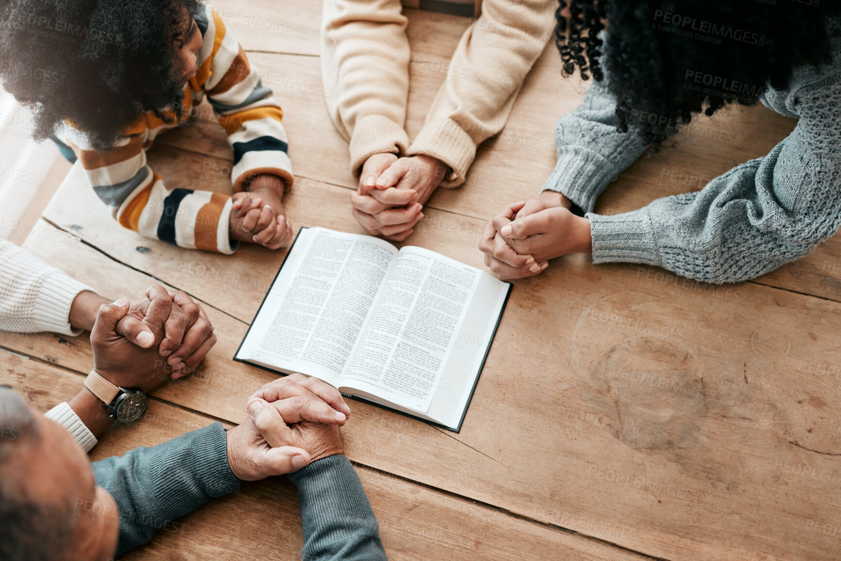 Buy stock photo Bible, reading book or hands of family in prayer, support or hope in Christianity home for worship together. Mother, father or grandparents studying, praying or learning God in religion with children