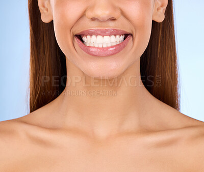 Buy stock photo Dental, teeth and smile of woman in studio for beauty, cleaning and self care. Oral hygiene, natural and cosmetic treatment with girl model isolated on blue background for veneers, fresh or results