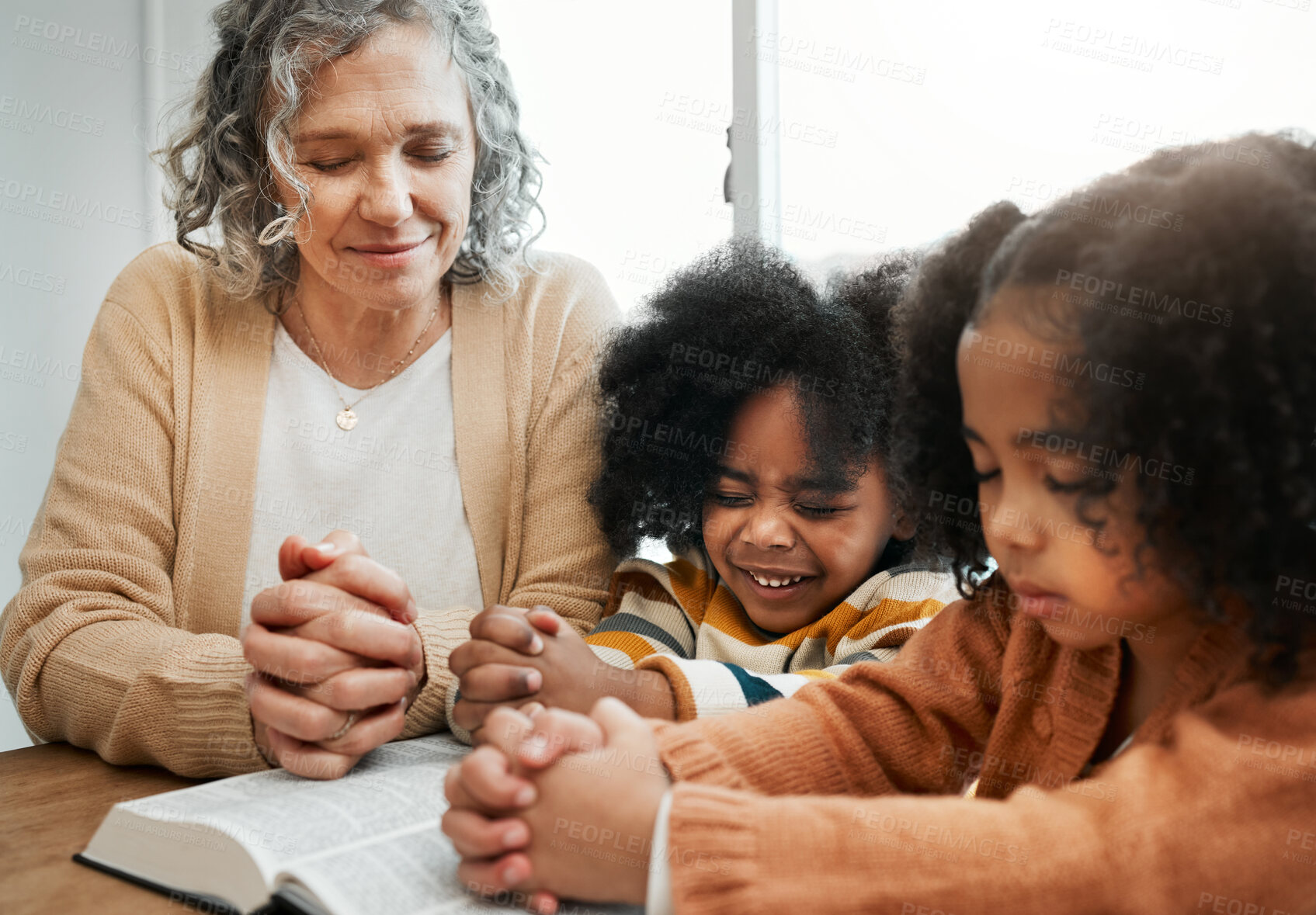 Buy stock photo Bible, prayer or grandmother praying with kids or siblings for worship, support or hope in Christianity. Children education, family or old woman studying, reading book or learning God in religion