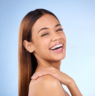 Buy stock photo Skincare, hand on shoulder and portrait of woman laughing in studio, skin care on blue background. Makeup, facial detox cosmetics and smile on face, hispanic model with natural beauty for dermatology