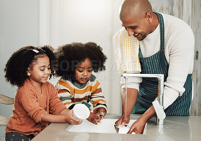 Buy stock photo Cleaning, learning and happy with black family in kitchen for bonding, hygiene and teaching. Smile, support and natural with father and children rinse dishes at home for sanitary, washing and chores