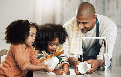 Buy stock photo Happy, cleaning and father with children in kitchen for bonding, hygiene or teaching. Smile, support and chores with black family washing dishes at home for sanitary, responsibility or housekeeping