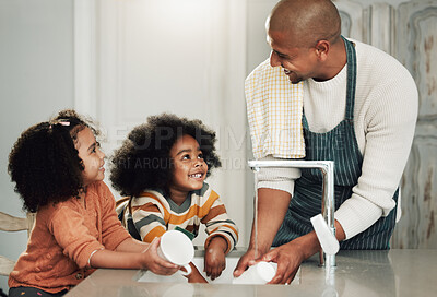 Buy stock photo Cleaning, help and happy with black family in kitchen for bonding, hygiene or teaching. Smile, support and natural with father and children at home for sanitary, responsibility or housekeeping chores