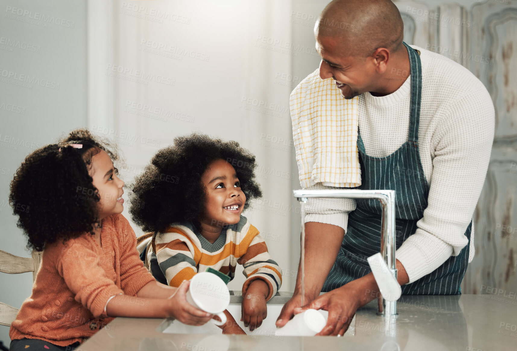 Buy stock photo Cleaning, help and happy with black family in kitchen for bonding, hygiene or teaching. Smile, support and natural with father and children at home for sanitary, responsibility or housekeeping chores