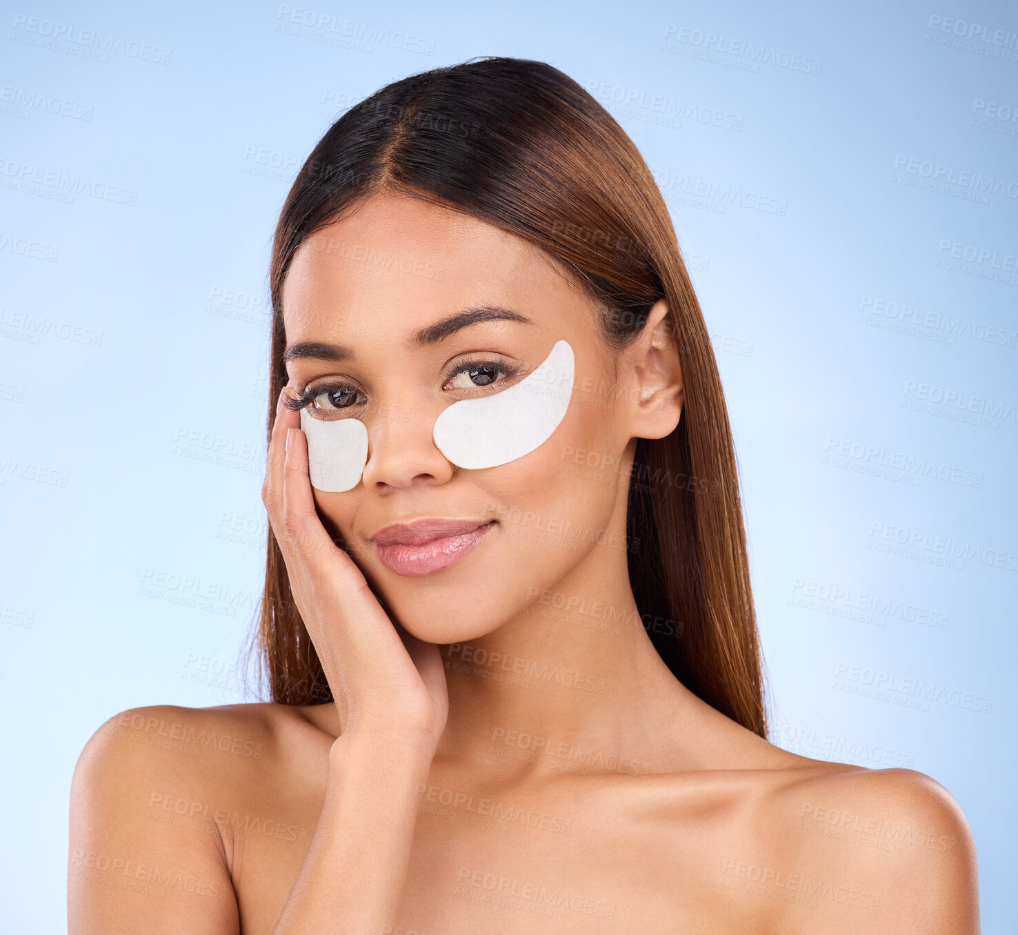 Buy stock photo Skincare, collagen pads and portrait of woman with eye mask for anti aging skin glow on blue background. Cosmetics, facial repair and face of beauty model with wrinkle treatment product in studio.