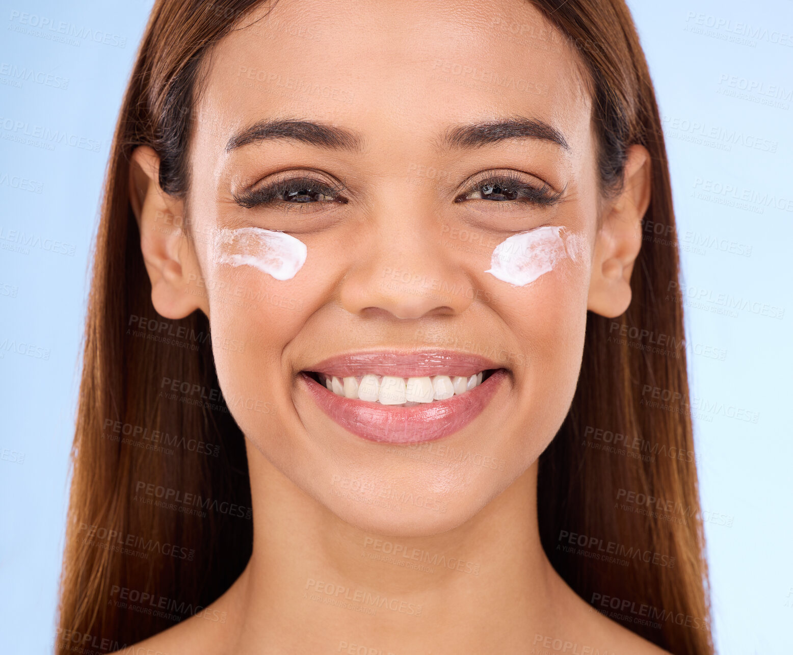 Buy stock photo Skincare, eye cream and fresh face of happy woman with anti aging skin care beauty treatment on blue background. Cosmetics, facial and portrait of hispanic model with collagen product in studio promo