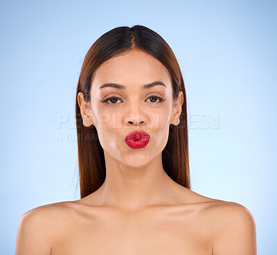 Buy stock photo Woman, beauty and red lipstick makeup portrait with cosmetics on face in studio. Aesthetic female model on a blue background for self care, facial glow and shine or color for lips and skin wellness
