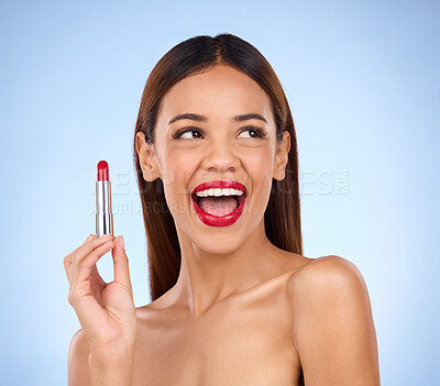 Buy stock photo Beauty, red lipstick and makeup of woman thinking about skincare or cosmetics promotion in studio. Excited female model on a blue background for self care, facial glow and skin with product color