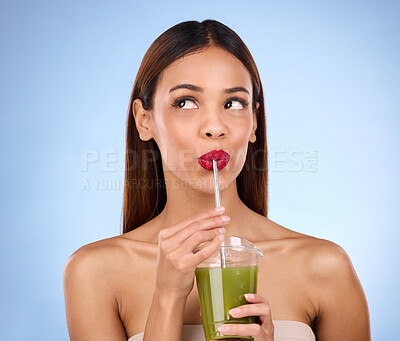 Buy stock photo Beauty, smoothie and health with woman in studio for detox, nutrition and diet. Organic, drinking and minerals with girl model and green juice on blue background for vegan, fiber and protein