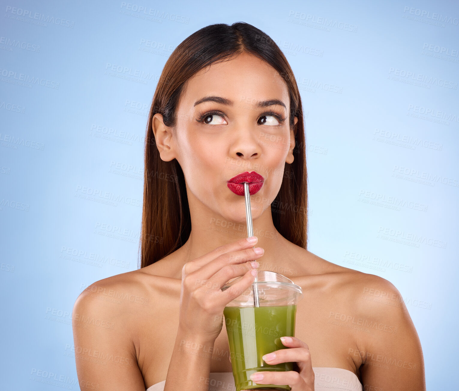 Buy stock photo Beauty, smoothie and health with woman in studio for detox, nutrition and diet. Organic, drinking and minerals with girl model and green juice on blue background for vegan, fiber and protein