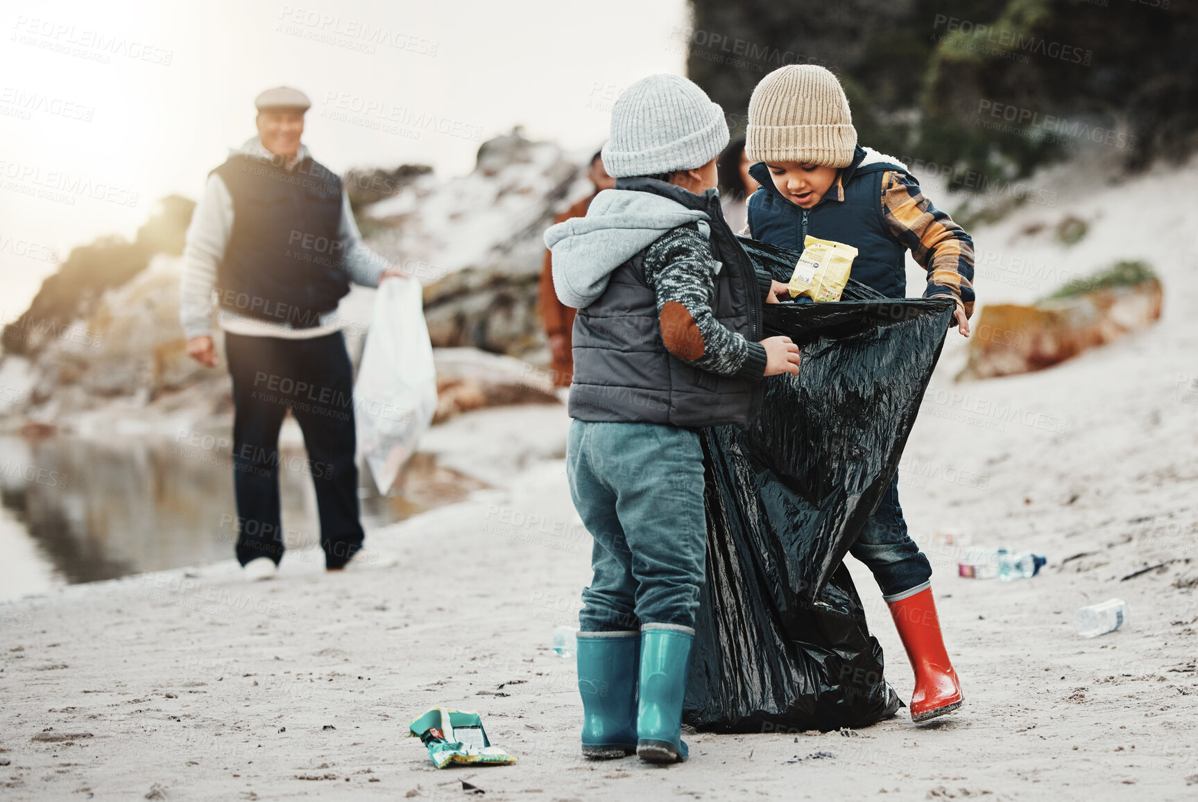 Buy stock photo Environment, plastic bags and children on beach, recycle and cleaning on earth day, reduce waste and helping. Friends, volunteers and kids with climate change project, sustainability or pick up trash