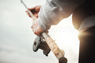 Buy stock photo Hands, fishing and rod with a man in nature, enjoying a weekend trip his hobby or pastime at sunset. Morning, flare and low angle with a male fisherman casting a line outdoor in the wilderness