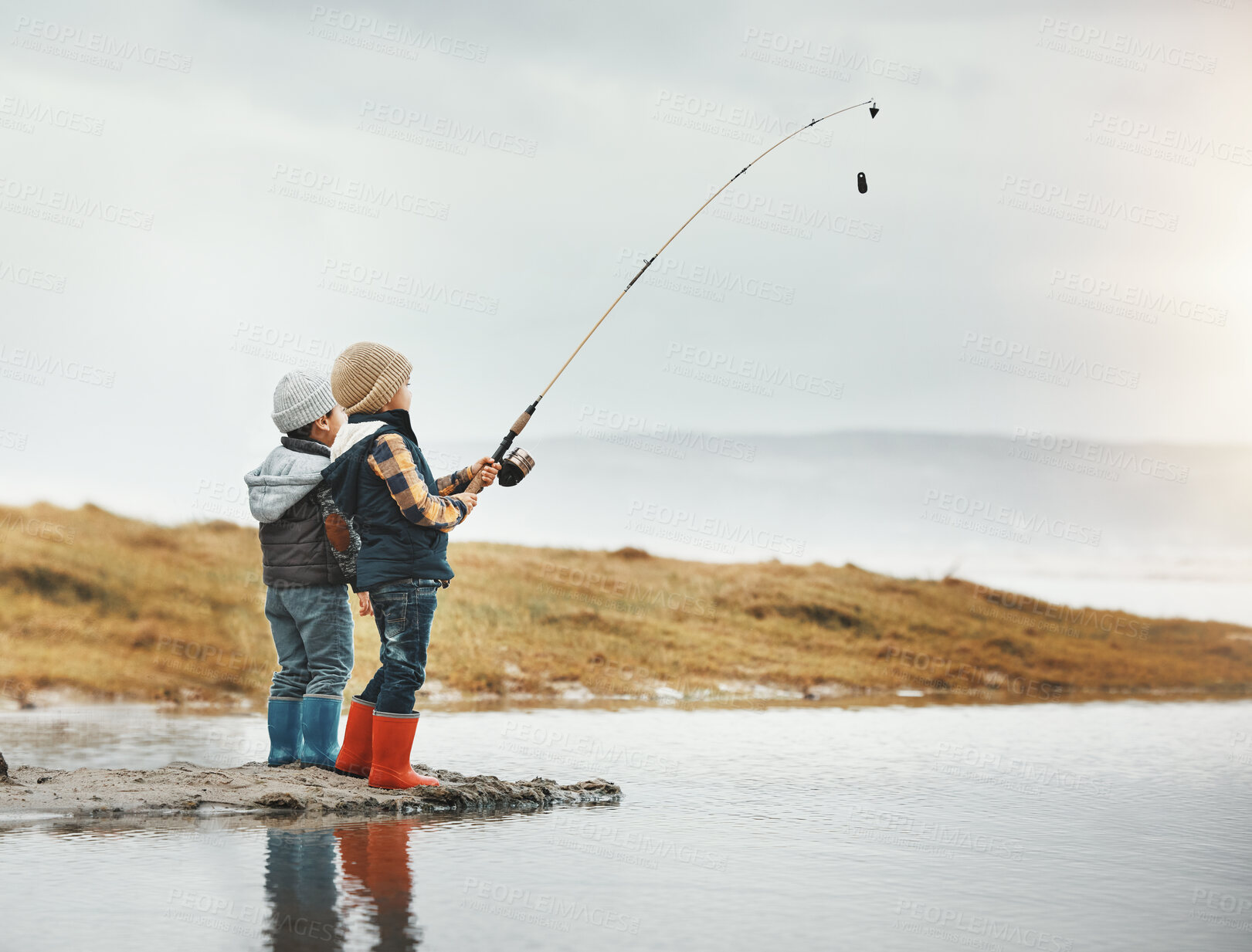 Buy stock photo Lake, activity and children fishing while on vacation, adventure or weekend trip for a hobby. Outdoor, nature and boy siblings or kids catching fish in water together while on holiday in countryside.