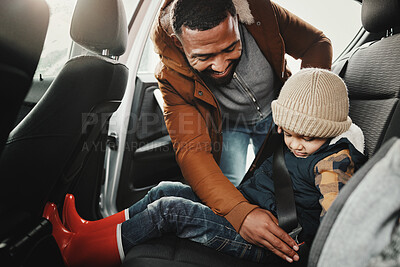 Buy stock photo Father help child fasten seat belt leaving for vacation, trip or holiday in a car before travel together. Transport, transportation and dad or parent with kid in a vehicle for a getaway