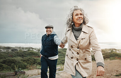 Buy stock photo Beach, love and senior couple holding hands on romantic evening walk in nature on happy date. Smile, romance and retirement, old woman and man walking on ocean path at sunset on holiday in Australia.