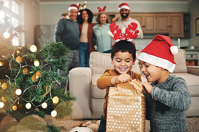 Buy stock photo Christmas, curious and children opening gifts, looking at presents and boxes together. Smile, festive and kids ready to open a gift or present under the tree for celebration of a holiday at home