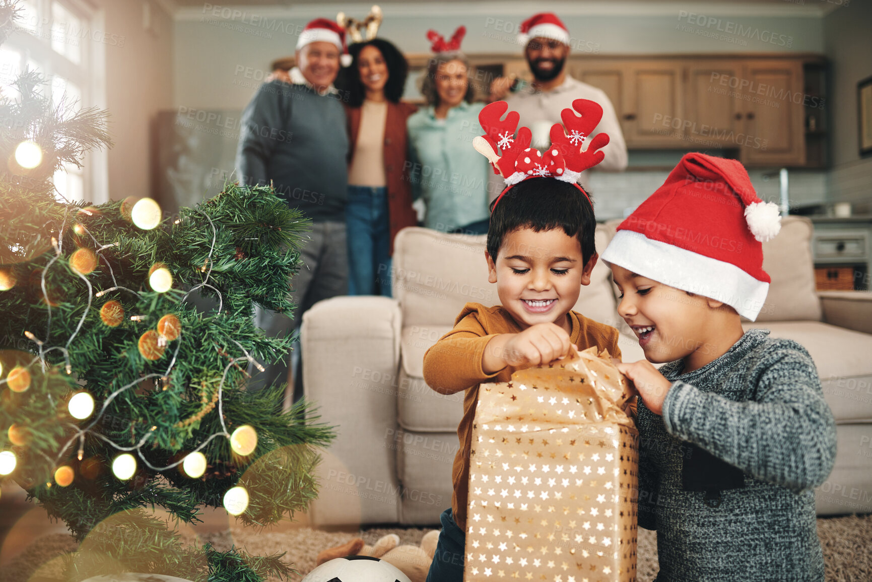 Buy stock photo Christmas, curious and children opening gifts, looking at presents and boxes together. Smile, festive and kids ready to open a gift or present under the tree for celebration of a holiday at home