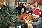 Love, Christmas and family opening presents, festive and happiness with quality time, love and bonding. Grandparents, mother and children with gifts, Xmas or loving together with smile or celebration