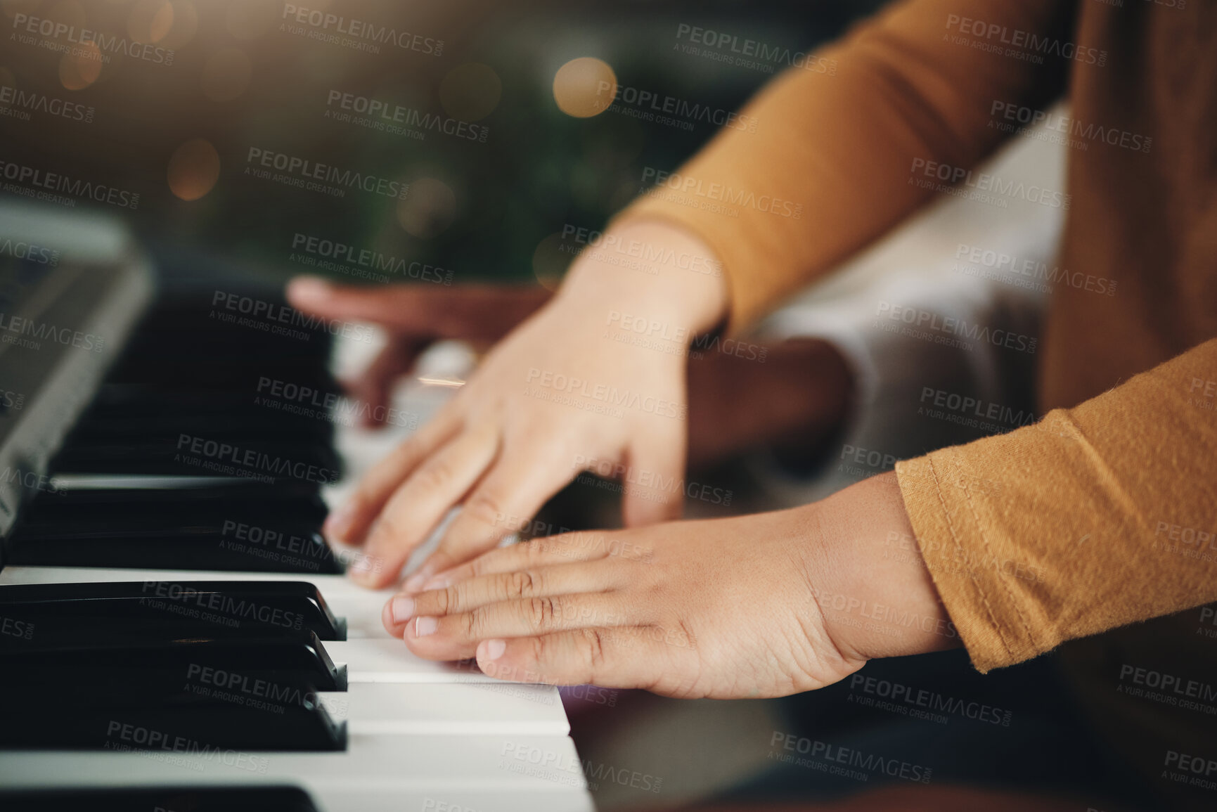 Buy stock photo Learning, piano and hands of a child and parent playing a song together. Education, music and zoom of a kid with a dad teaching an instrument during a musical lesson, help and showing to play