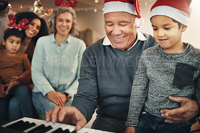 Christmas, photo album or memories with a grandmother and kids looking at  photographs during festiv Stock Photo by YuriArcursPeopleimages