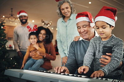 Buy stock photo Piano, christmas and elderly man with grandson in a living room, happy and celebration while bonding in their home. Family, music and retired senior man with boy, festive and learning instrument