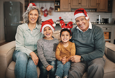 Buy stock photo Portrait, christmas and grandparents on the sofa with their grandchildren in the living room as a family. Love, kids or celebration with a senior man, woman and kids together in their lounge