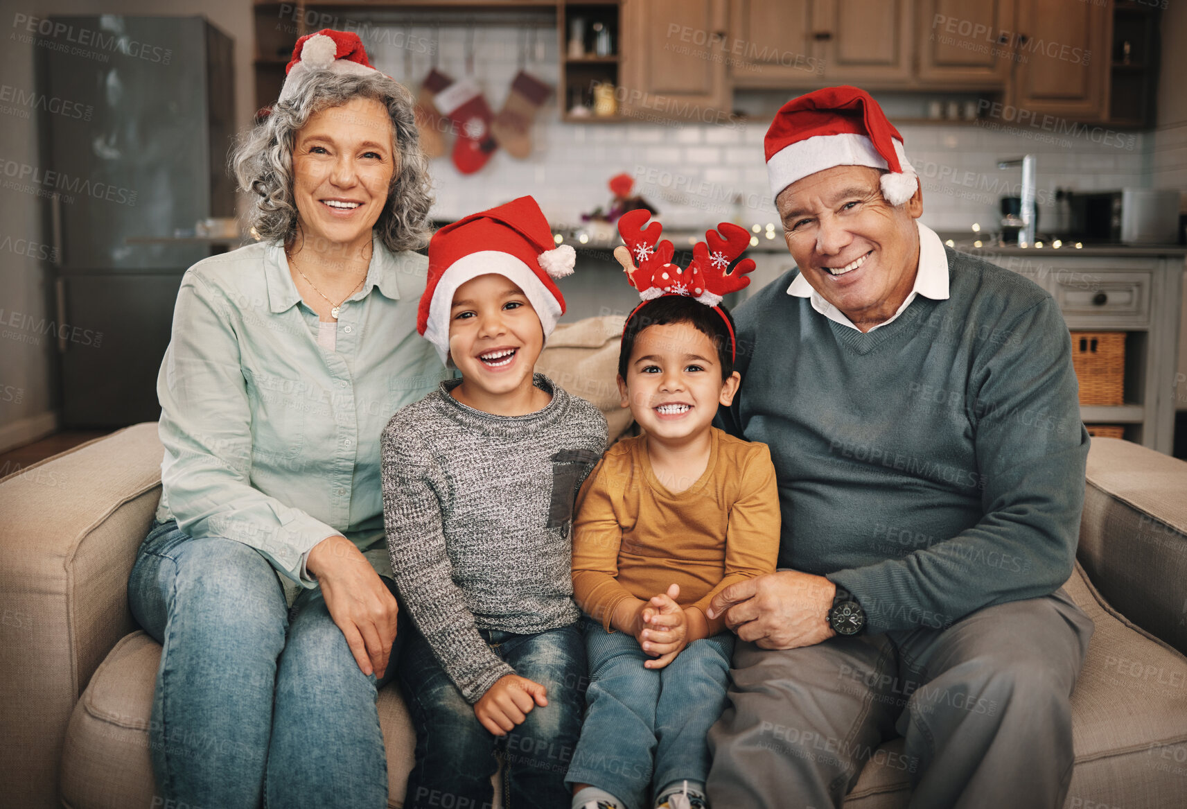 Buy stock photo Portrait, christmas and grandparents on the sofa with their grandchildren in the living room as a family. Love, kids or celebration with a senior man, woman and kids together in their lounge