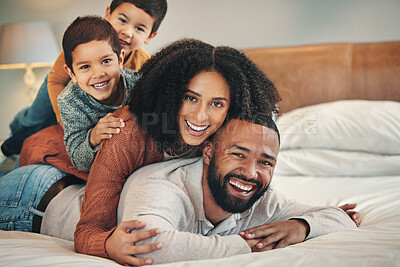 Buy stock photo Laughing, family and portrait smile on bed in bedroom, bonding and care in home. Love, comedy and happy mother, comic father and funny children playing, having fun and enjoying quality time together.