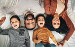 Laughing, family and top view portrait on bed in bedroom, bonding and care in home. Love, smile and happy mother, comic father and funny children playing, having fun and enjoying joke time together.