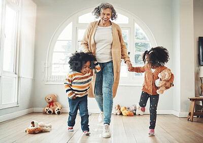 Buy stock photo Happy family, grandmother and children play hopscotch in home having fun, enjoy games and relax in bedroom. Bonding, entertainment and grandma with kids for jumping, playing and numbers activity