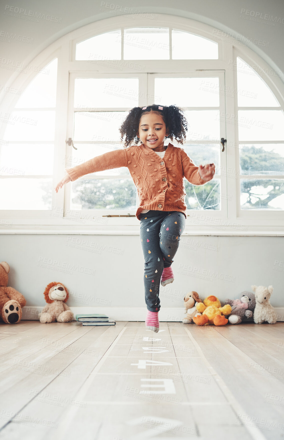 Buy stock photo Hopscotch, happy and girl play in home having fun, enjoying games and relax in bedroom. Childhood, kindergarten and excited child balance for jumping game, playing and entertainment activity on floor