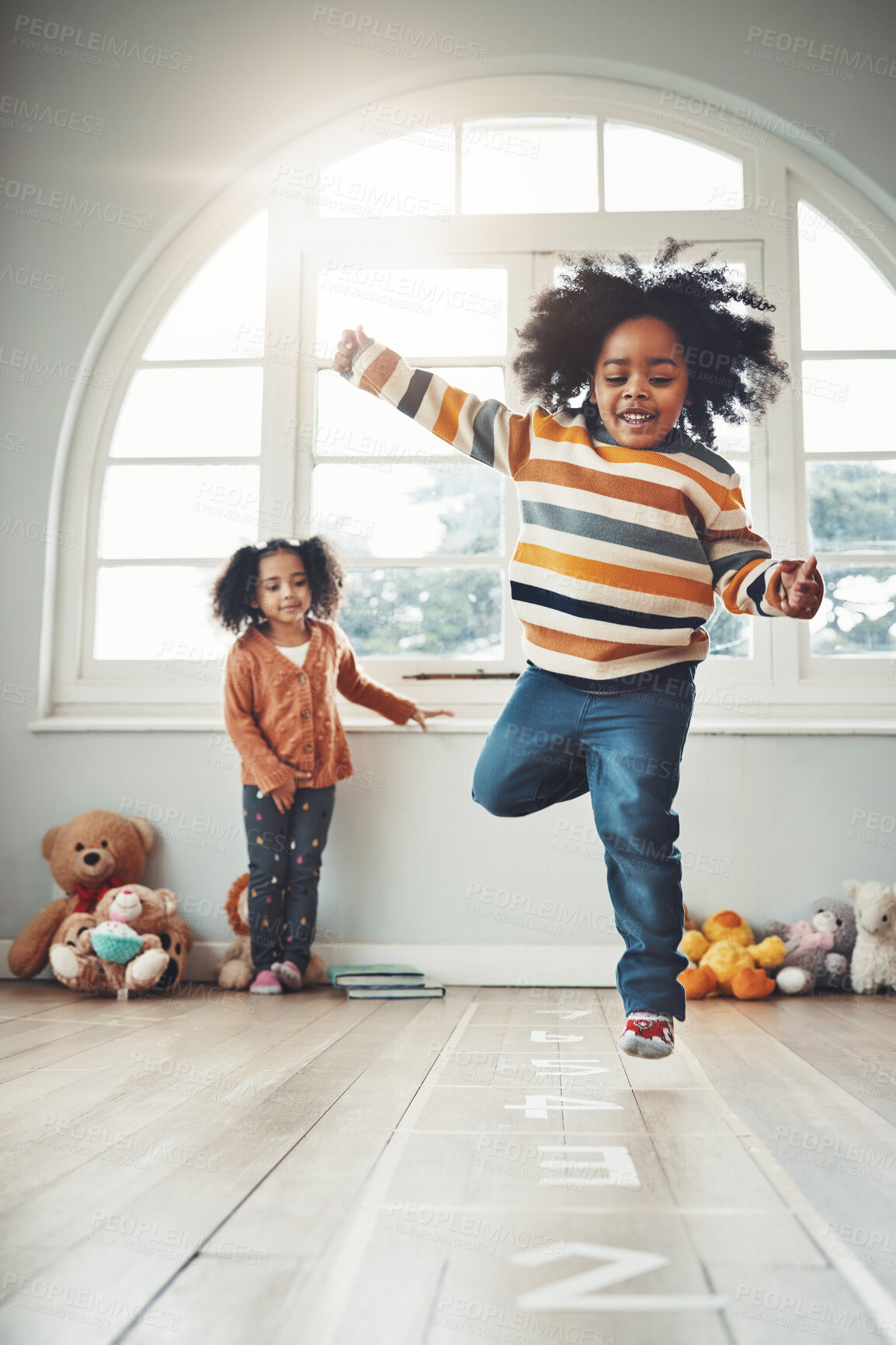 Buy stock photo Hopscotch, games and children play in home having fun, enjoy entertainment and relax together in room. Childhood, happy and excited siblings in bedroom for jumping game, playing and activity on floor