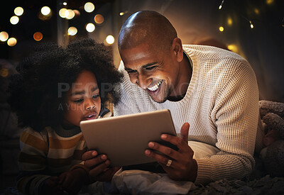 Buy stock photo Night, tablet and happy with father and son in blanket tent for connection, relax and streaming cartoon. Smile, app and bonding with man and boy at home for education, internet and online