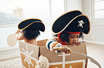 Playing, box ship and pirate children role play, fantasy imagine or pretend in cardboard container. Creative boat, fun home game or sailing black kids on Halloween cruise adventure with yacht captain