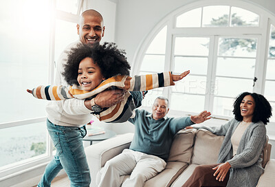 Buy stock photo Airplane, playful and happy with family in living room for bonding, affectionate and support. Games, balance and weekend with father carrying child at home for free time, flying and laughing